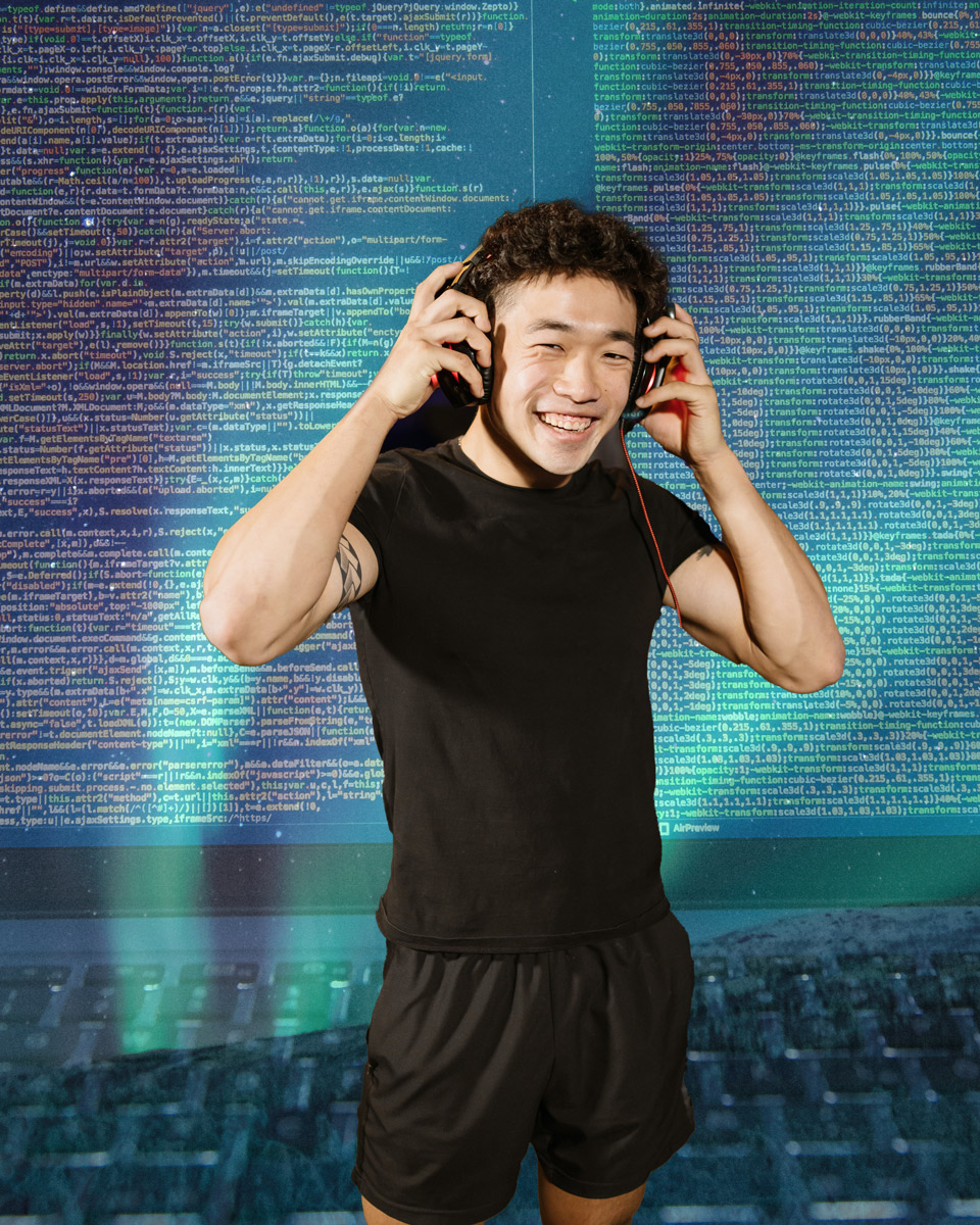 Man wearing headphones with a spacey code background