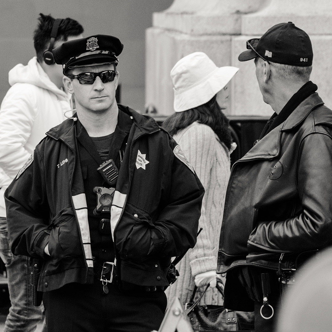 Black and white photo of SFPD officer on a street beat