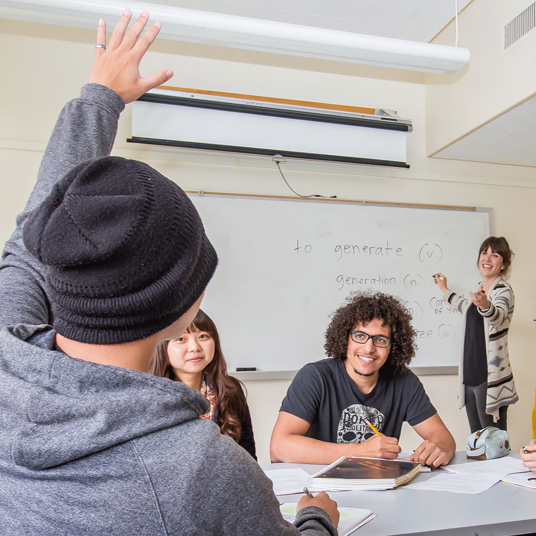 Student raises his hand and is called on by the teacher in English class