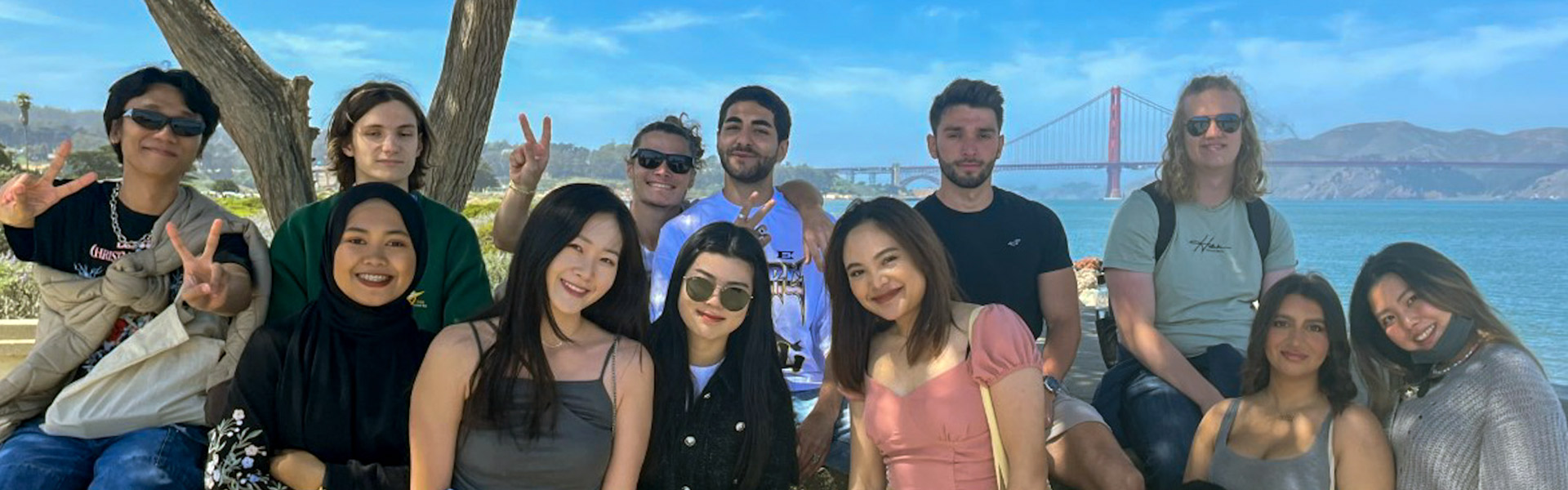 Group of international students pose with the Golden Gate Bridge in the background
