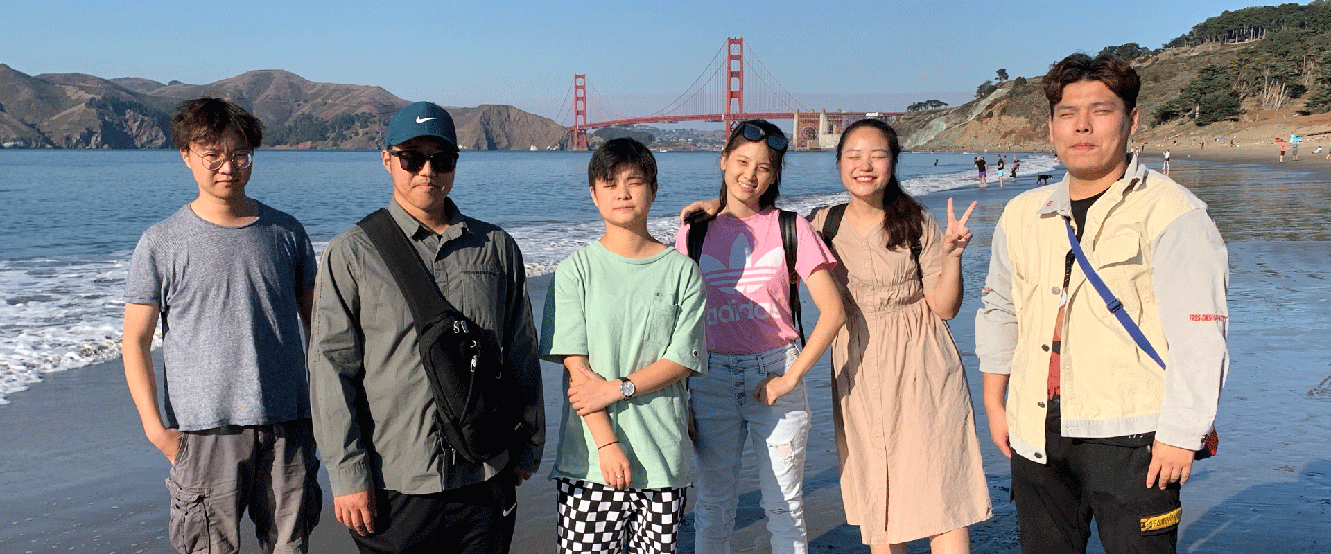 International Students at the beach, with the Golden Gate Bridge behind them