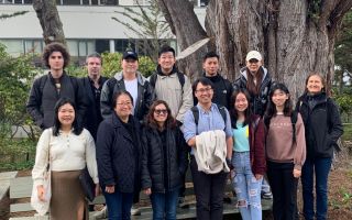 International students by a tree on campus