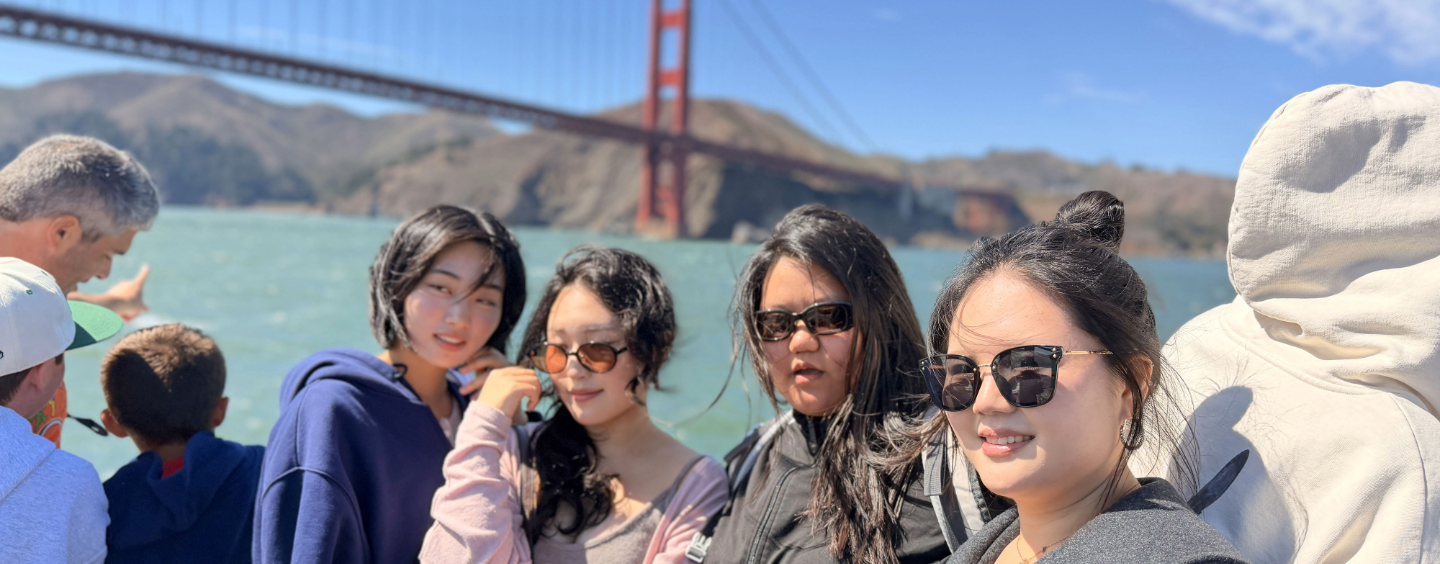 International students on a bay cruise by the Golden Gate Bridge