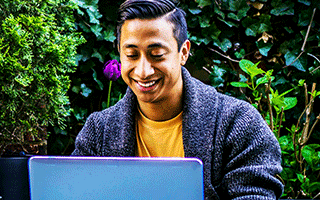 Interpretation student taking online course on laptop
