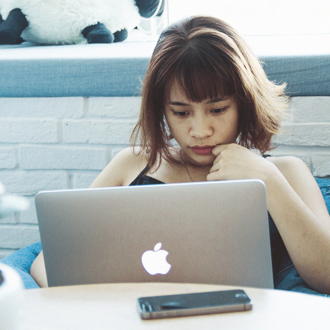 Student at home on her laptop