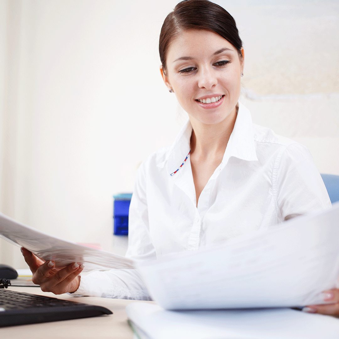 Medical Administrative Assistant with paperwork