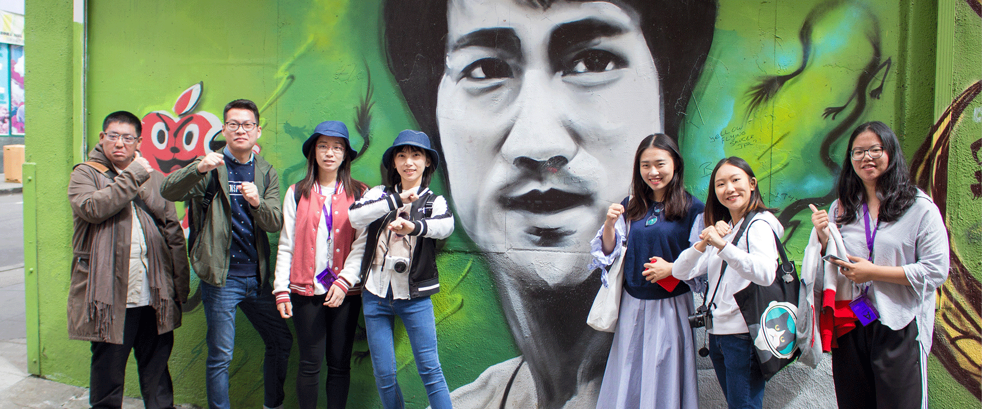 San Francisco Discover students in front of a Bruce Lee mural