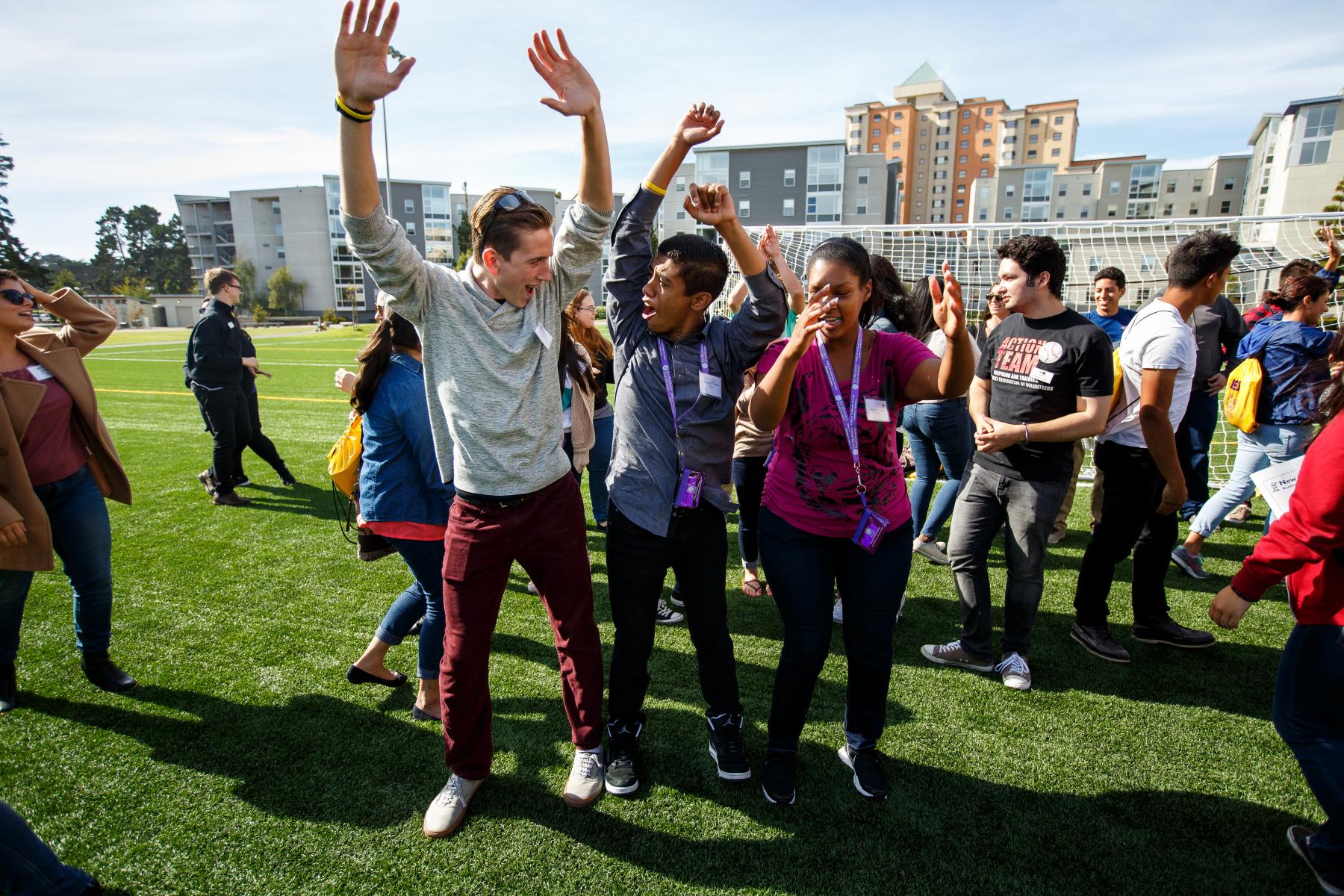 Students and coach on the soccer field