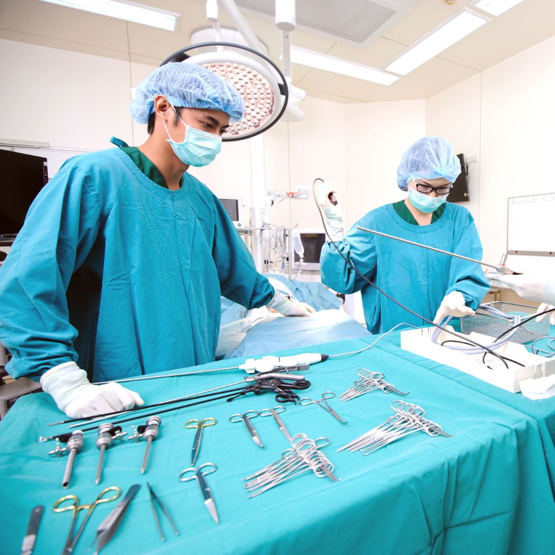 Sterile Processing Technician in the operating room with surgical tools