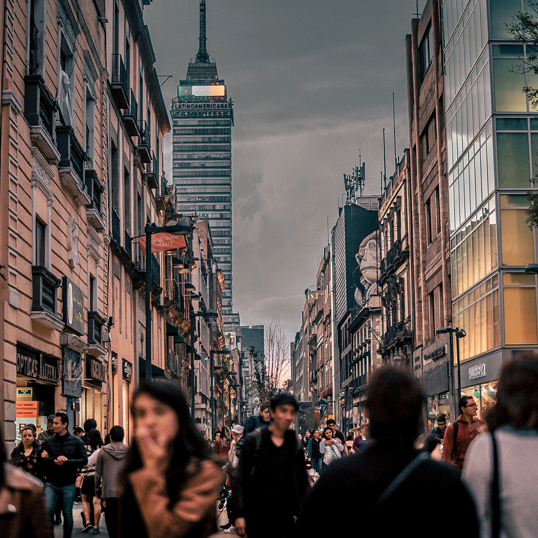 A bustling street in Mexico at night