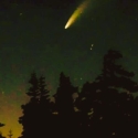 A comet streaks through the starry sky over the Sierra Nevada Field Campus