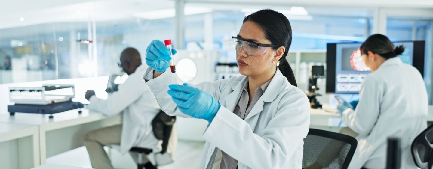 Specialist in Blood Bank Technology working in the lab with other scientists