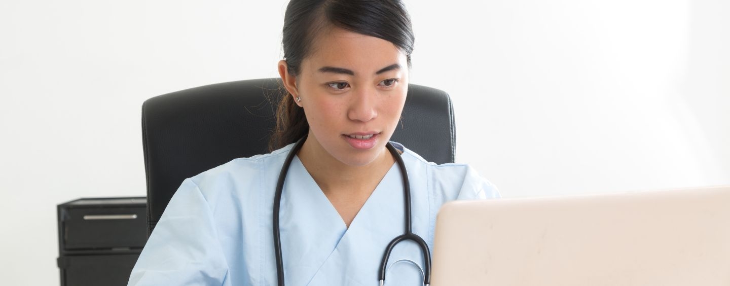 Medical assistant taking an online course