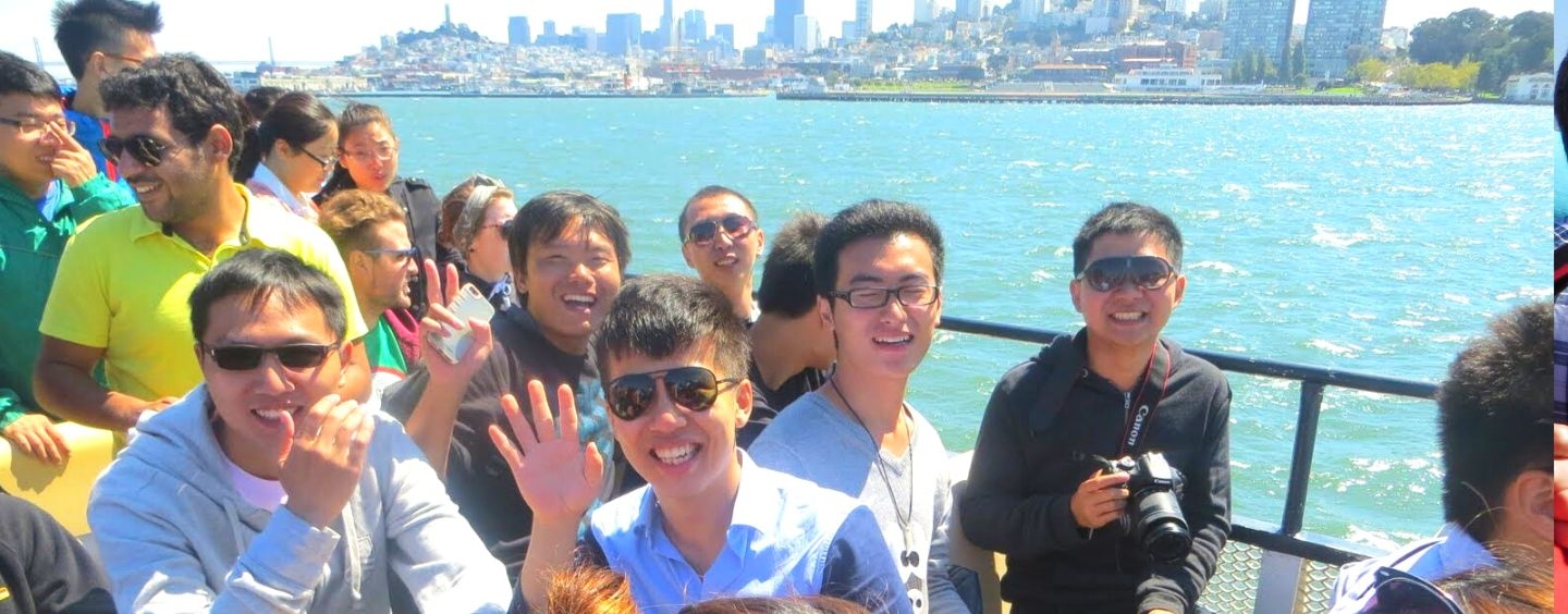 International students cruise the San Francisco Bay and wave