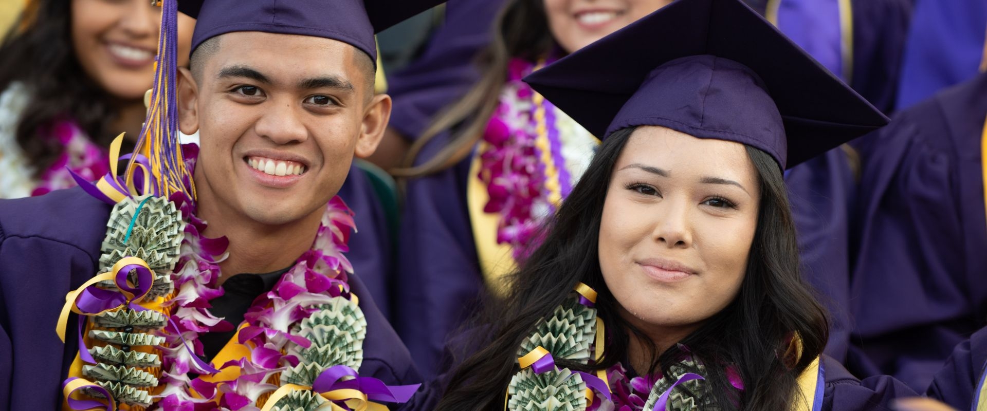 SF State students in money leis at Commencement