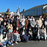 International students about to take a bay cruise. Many wear masks.
