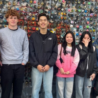 International students in front of street art