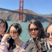 International students on a bay cruise by the Golden Gate Bridge