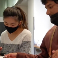 Peer mentor Judy Deng (left) and Inclusion Pilot Project student Ishaan Joshi prepare food in the Vista Room on campus