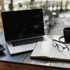 Laptop, notebook, glasses and coffee