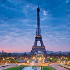 the Eiffel Tower in Paris, during the pink moment at dusk