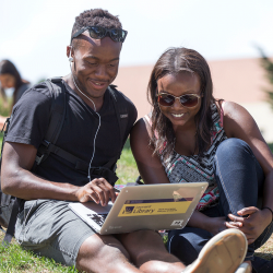 Students take an online class outside