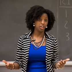 Teacher lecturing in front of class