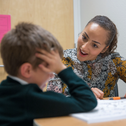 Teacher working with a child