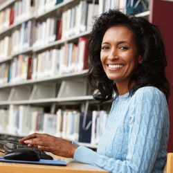 Teacher taking E-Learning online class at the library