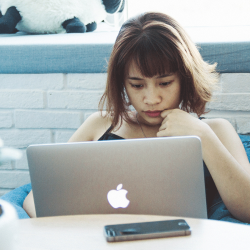 Student at home on her laptop