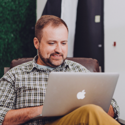 Network Administrator working on a laptop