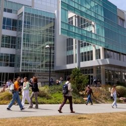 Students walking past the campus library