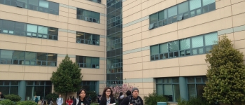 international students walk away from the Humanities Building