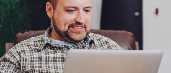 Network Administrator working on a laptop