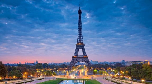 the Eiffel Tower in Paris, during the pink moment at dusk